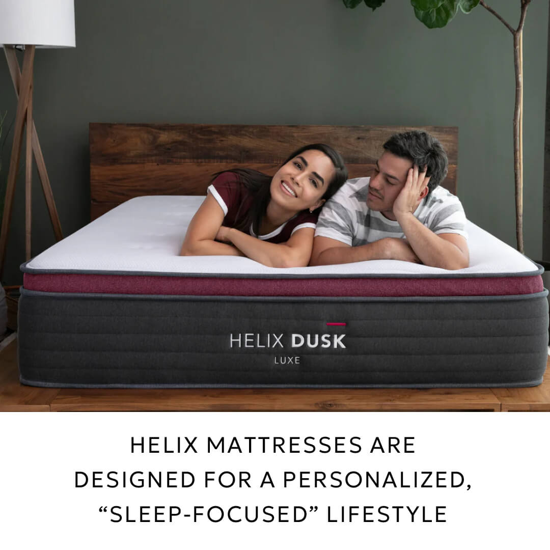 Couple relaxing on a Helix Dusk Luxe mattress.
