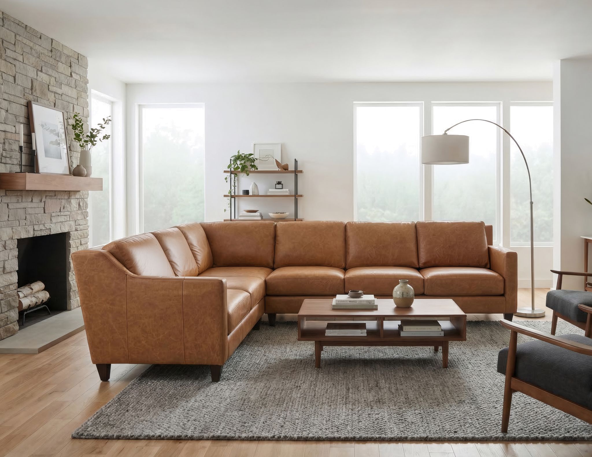 Cognac leather sectional sofa in a modern, bright living room.